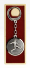 Médaille montée sur porte-clefs obtenue après la victoire en championnat de 3e division du district en 1977