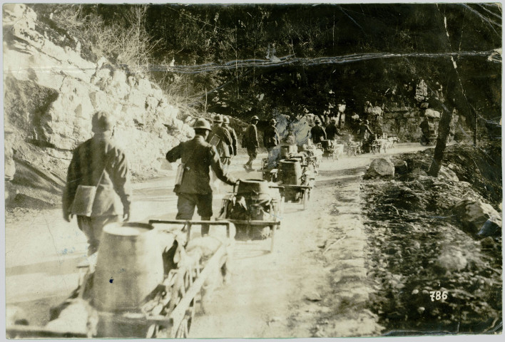 DOG TRAZIN CONVEYING WATER FROM A SUPPLY BASE TO TROOPS AT THE FRONT. IT IS SURPRISING THE AMOUNT OF WATER THAT GAN BE SUPPLIED IN THIS WAY IN A SHORT TIME