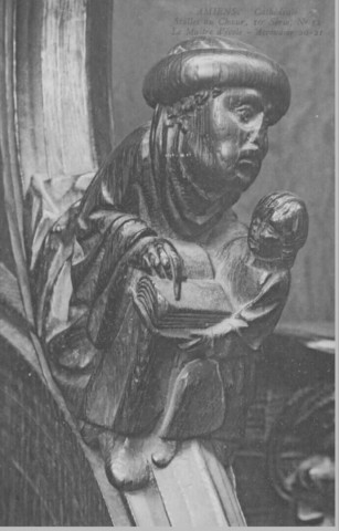 Cathédrale - Stalles du Choeur - 10è série, n° 12 - Le Maître d'école - Accoudoir 20-21