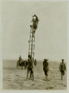 WITH THE TROOPS IN MESOPOTAMIA. INDIAN SAPPERS REMOVING ELECTRIC FITTING FROM TURKISH TELEPHONE LINES