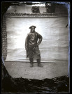 Cayeux-sur-Mer. Marin en ciré posant devant une tenture