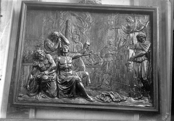 Eglise de Sailly-Laurette : détail d'un panneau de bois sculpté représentant le martyre d'un Saint