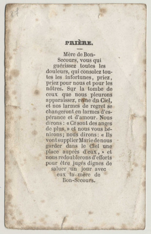 Consolatrice des affligés, priez pour nous. Femme priant devant la vierge dans un cimetière