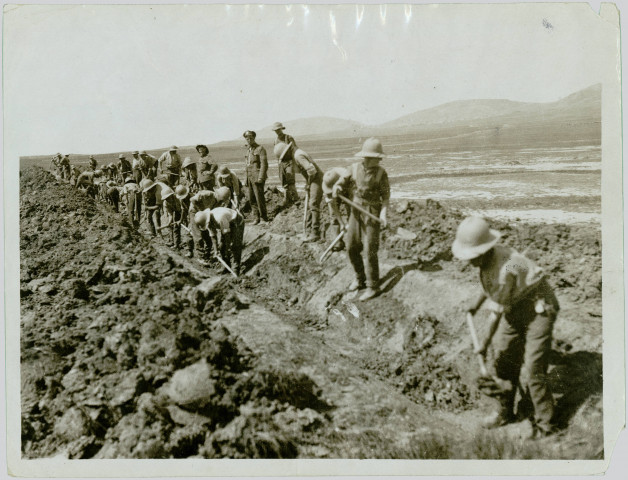 OFFICIAL PHOTOGRAPH TAKEN ON THE SALONIKA FRONT. LABOURS BATTALIONS AT WORK ON THE GREAT DAUBATALI MARSCHES DRAINING THE LAND TO PREVENT MALARIA.